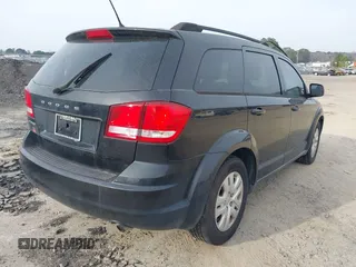 2013 Dodge Journey SE with VIN 3C4PDCAB0DT702977, listed as a IAAI auction lot 41797817 with 150,317 mi miles. Bid and sale history available at carsss.com. Image 4.