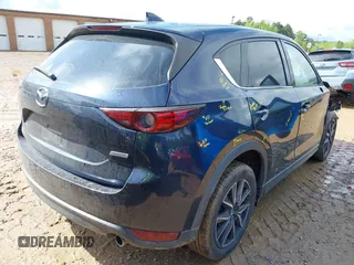 2018 Mazda CX-5 Grand Touring z VIN JM3KFADM8J1406007, wystawiony jako IAAI lot #42008567 z przebiegiem 110 661 mil mil oraz . Historia ofert i sprzedaży dostępna na DreamBid. Obrazek 4.