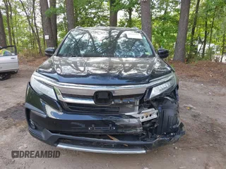 2019 Honda Pilot Touring 7-Passenger with VIN 5FNYF6H60KB030990, listed as a IAAI auction lot 42160762 with 68,807 mi miles and . Bid and sale history available at DreamBid. Image 12.