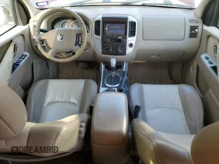 2005 Mercury Mariner Luxury z VIN 4M2YU56175DJ33563, wystawiony jako Copart lot #73497134 z przebiegiem 152 513 mil mil oraz Szkody całkowita. Historia ofert i sprzedaży dostępna na DreamBid. Obrazek 8.