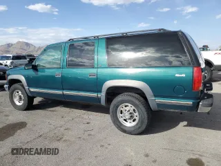 1997 GMC Suburban z VIN 3GKGK26J0VG522963, wystawiony jako Copart lot #56804105 z przebiegiem 297 544 mil mil oraz Tytuł czysty. Historia ofert i sprzedaży dostępna na DreamBid. Obrazek 2.