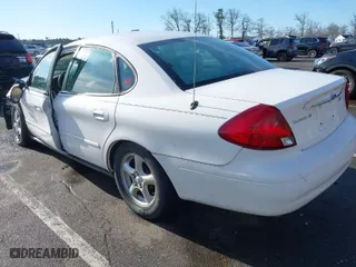 2003 Ford Taurus SE Standard with VIN 1FAFP53U13G210075, listed as a IAAI auction lot 41863786 with 64,943 mi miles. Bid and sale history available at carsss.com. Image 3.
