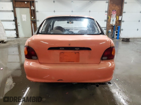 1997 Hyundai Accent z VIN KMHVD14NXVU221266, wystawiony jako Copart lot #86383044 z przebiegiem 159 517 mil mil oraz Szkoda całkowita • Salvage title. Historia ofert i sprzedaży dostępna na DreamBid. Obrazek 6.