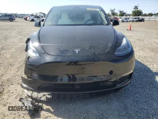 2023 Tesla Model Y Long Range with VIN 7SAYGAEE0PF642810, listed as a Copart auction lot 52181655 with 74,922 mi miles and Salvage Title. Bid and sale history available at DreamBid. Image 5.