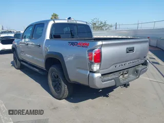 2021 Toyota Tacoma SR with VIN 5TFCZ5AN6MX270972, listed as a IAAI auction lot 42460823 with 76,062 mi miles and . Bid and sale history available at DreamBid. Image 3.