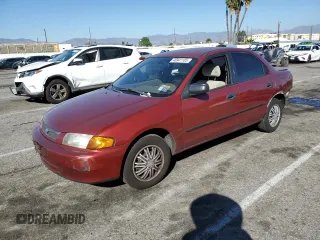 1998 Mazda Protege DX with VIN JM1BC1411W0198007, listed as a Copart auction lot 46941185 with 101,696 mi miles and Salvage Title. Bid and sale history available at DreamBid. Image 1.