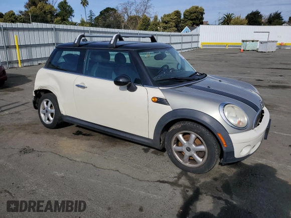 2010 MINI Hardtop with VIN WMWMF3C57ATU77370, listed as a Copart auction lot 50078605 with 187,187 mi miles and Salvage title. Bid and sale history available at DreamBid. Image 4.