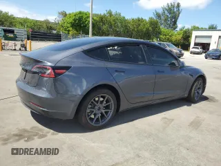 2023 Tesla Model 3 with VIN 5YJ3E1EA8PF704349, listed as a Copart auction lot 60220665 with 18,873 mi miles and Non repairable. Bid and sale history available at DreamBid. Image 3.