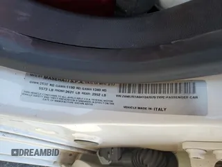 2017 Maserati Ghibli S Q4 z VIN ZAM57RTA6H1247079, wystawiony jako Copart lot #52099755 z przebiegiem 124 159 mil mil oraz Szkody całkowita. Historia ofert i sprzedaży dostępna na DreamBid. Obrazek 12.