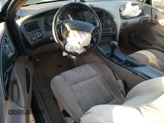 1995 Ford Thunderbird LX z VIN 1FALP6248SH176946, wystawiony jako Copart lot #74066554 z przebiegiem 72 666 mil mil oraz Szkoda całkowita • Salvage title. Historia ofert i sprzedaży dostępna na DreamBid. Obrazek 8.