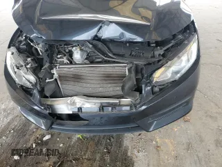 2017 Honda Civic LX z VIN 19XFC2F54HE014695, wystawiony jako Copart lot #57439725 z przebiegiem 88 092 mil mil oraz Szkoda całkowita • Salvage title. Historia ofert i sprzedaży dostępna na DreamBid. Obrazek 11.