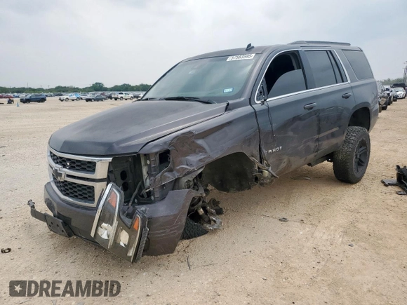 2015 Chevrolet Tahoe LT with VIN 1GNSKBKC1FR139281, listed as a Copart auction lot 57583595 with 142,090 mi miles and Salvage title. Bid and sale history available at DreamBid. Image 1.
