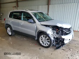 2013 Volkswagen Tiguan SE with VIN WVGBV7AX1DW504036, listed as a Copart auction lot 61126145 with 148,399 mi miles and Salvage title. Bid and sale history available at DreamBid. Image 4.