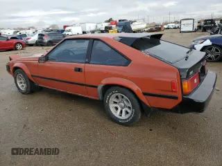 1983 Toyota Supra z VIN JT2MA67L9D0056034, wystawiony jako Copart lot #82382484 z przebiegiem 39 338 mil mil oraz Szkoda całkowita • Salvage title. Historia ofert i sprzedaży dostępna na DreamBid. Obrazek 2.