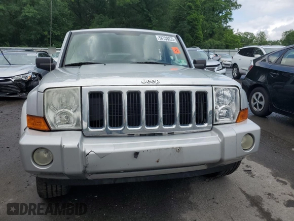 2009 Jeep Commander Sport z VIN 1J8HG48K29C531877, wystawiony jako Copart lot #58708825 z przebiegiem 198 585 mil mil oraz Szkoda całkowita • Salvage title. Historia ofert i sprzedaży dostępna na DreamBid. Obrazek 5.