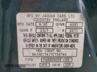 1996 Jaguar XJ with VIN SAJHX1741TC758740, listed as a Copart auction lot 73377914 with 140,964 mi miles and Salvage title. Bid and sale history available at DreamBid. Image 14.