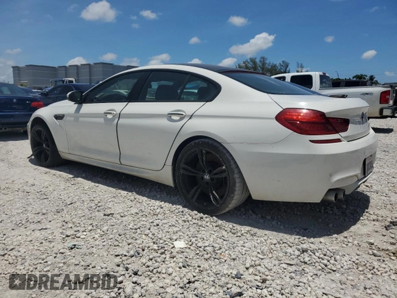 2014 BMW M6 with VIN WBS6C9C55ED467226, listed as a Copart auction lot 61779015 with Not provided miles and Salvage title. Bid and sale history available at DreamBid. Image 2.