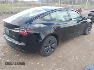 2021 Tesla Model 3 Long Range with VIN 5YJ3E1EB7MF052988, listed as a IAAI auction lot 42052662 with 29,877 mi miles and . Bid and sale history available at carsss.com. Image 4.