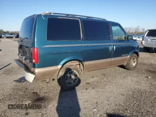 1999 GMC Safari with VIN 1GKEL19W0XB509860, listed as a Copart auction lot 84671294 with 141,872 mi miles and Salvage Title. Bid and sale history available at carsss.com. Image 3.