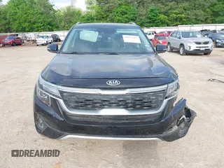 2021 Kia Seltos EX with VIN KNDERCAAXM7228380, listed as a IAAI auction lot 42015912 with 61,612 mi miles. Bid and sale history available at carsss.com. Image 13.