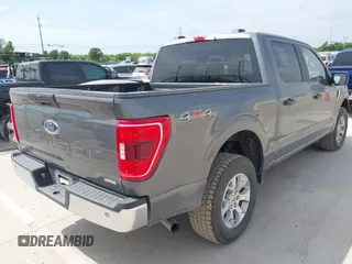 2023 Ford F-150 XL with VIN 1FTFW1E87PKF04735, listed as a IAAI auction lot 42048913 with 54,893 mi miles. Bid and sale history available at carsss.com. Image 4.