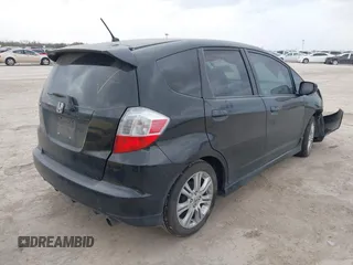 2009 Honda Fit Sport with VIN JHMGE88499S027610, listed as a IAAI auction lot 41712904 with 147,069 mi miles. Bid and sale history available at carsss.com. Image 4.