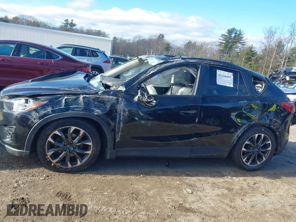 2016 Mazda CX-5 Grand Touring with VIN JM3KE4DY4G0909782, listed as a IAAI auction lot 41006111 with 30,135 mi miles. Bid and sale history available at carsss.com. Image 13.