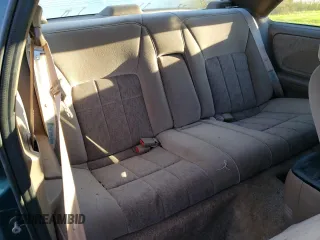 1995 Ford Thunderbird LX z VIN 1FALP6248SH176946, wystawiony jako Copart lot #74066554 z przebiegiem 72 666 mil mil oraz Szkoda całkowita • Salvage title. Historia ofert i sprzedaży dostępna na DreamBid. Obrazek 11.