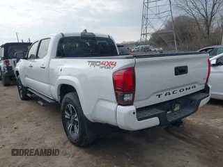 2018 Toyota Tacoma SR5 with VIN 3TMDZ5BN9JM051105, listed as a IAAI auction lot 41708034 with 98,000 mi miles and . Bid and sale history available at DreamBid. Image 6.