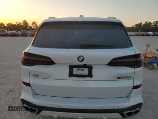 2024 BMW X5 M60i with VIN 5UX33EU07R9T12139, listed as a Copart auction lot 77326454 with 0 mi miles and Salvage Title. Bid and sale history available at carsss.com. Image 6.