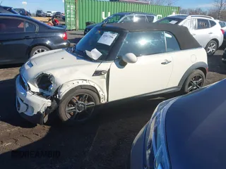 2011 MINI Convertible S with VIN WMWZP3C54BTX82748, listed as a IAAI auction lot 41817396 with 113,458 mi miles and . Bid and sale history available at DreamBid. Image 2.