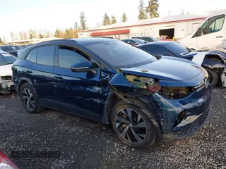 2023 Volkswagen ID.4 Pro z VIN 1V2DNPE81PC017620, wystawiony jako IAAI lot #41573053 z przebiegiem 15 462 mil mil oraz . Historia ofert i sprzedaży dostępna na DreamBid. Obrazek 14.
