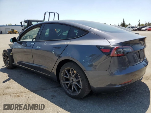 2023 Tesla Model 3 with VIN 5YJ3E1EA4PF615975, listed as a Copart auction lot 58845405 with 38,927 mi miles and Salvage title. Bid and sale history available at DreamBid. Image 2.