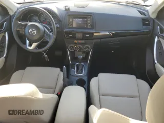 2015 Mazda CX-5 Sport z VIN JM3KE2BE6F0491107, wystawiony jako Copart lot #42462395 z przebiegiem 82 528 mil mil oraz Szkoda całkowita • Salvage title. Historia ofert i sprzedaży dostępna na DreamBid. Obrazek 8.