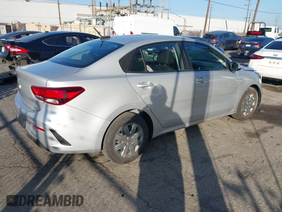2023 Kia Rio LX with VIN 3KPA24AD1PE599290, listed as a IAAI auction lot 41023283 with 10,027 mi miles and . Bid and sale history available at DreamBid. Image 4.