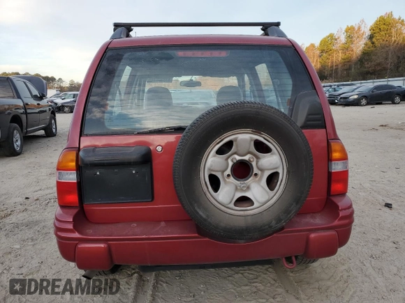 2000 Chevrolet Tracker z VIN 2CNBE13C4Y6944341, wystawiony jako Copart lot #81930714 z przebiegiem 109 501 mil mil oraz Szkoda całkowita • Salvage title. Historia ofert i sprzedaży dostępna na DreamBid. Obrazek 6.