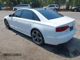 2017 Audi A8 Sport with VIN WAU43AFD3HN010445, listed as a IAAI auction lot 42714864 with 106,748 mi miles and . Bid and sale history available at DreamBid. Image 3.