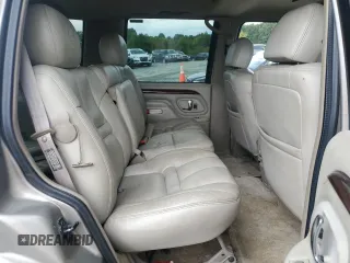 2000 Cadillac Escalade z VIN 1GYEK13R5YR112858, wystawiony jako Copart lot #71651294 z przebiegiem 228 689 mil mil oraz Szkody całkowita. Historia ofert i sprzedaży dostępna na DreamBid. Obrazek 12.