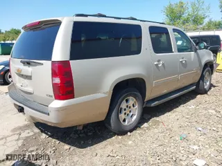 2012 Chevrolet Suburban LT with VIN 1GNSCJE03CR128206, listed as a IAAI auction lot 42002119 with 329,078 mi miles. Bid and sale history available at carsss.com. Image 4.