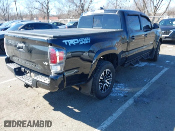 2021 Toyota Tacoma 4WD SR5 with VIN 3TMDZ5BN4MM117564, listed as a IAAI auction lot 41629220 with 77,063 mi miles. Bid and sale history available at carsss.com. Image 4.