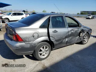 2007 Ford Focus S z VIN 1FAHP34N77W192231, wystawiony jako Copart lot #59020505 z przebiegiem 99 284 mil mil oraz Szkoda całkowita • Salvage title. Historia ofert i sprzedaży dostępna na DreamBid. Obrazek 3.