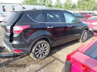 2018 Ford Escape Titanium with VIN 1FMCU9J95JUB30803, listed as a IAAI auction lot 42286536 with 63,309 mi miles and . Bid and sale history available at DreamBid. Image 4.