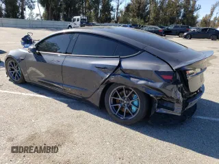 2023 Tesla Model 3 Long Range with VIN 5YJ3E1EB4PF633935, listed as a Copart auction lot 45238705 with 32,972 mi miles and Salvage Title. Bid and sale history available at DreamBid. Image 2.
