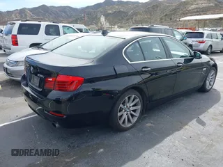 2014 BMW 5 Series 535i with VIN WBA5B1C54ED476763, listed as a IAAI auction lot 41590236 with 115,048 mi miles and . Bid and sale history available at DreamBid. Image 4.