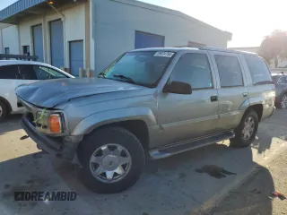2000 Cadillac Escalade z VIN 1GYEK13R5YR107157, wystawiony jako Copart lot #89024795 z przebiegiem 172 599 mil mil oraz Szkody całkowita. Historia ofert i sprzedaży dostępna na DreamBid. Obrazek 1.