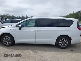 2023 Chrysler Pacifica Hybrid Touring L with VIN 2C4RC1L77PR541513, listed as a IAAI auction lot 42433421 with 53,979 mi miles and . Bid and sale history available at DreamBid. Image 15.