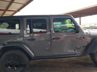 2020 Jeep Wrangler Unlimited Black and Tan с VIN 1C4HJXDG3LW266615, выставлен на аукционе IAAI как лот 42207899 с пробегом 55 291 миль миль и . История ставок и продаж доступна на DreamBid. Изображение 13.