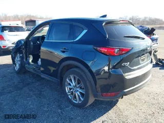 2021 Mazda CX-5 Grand Touring with VIN JM3KFBDM4M0471467, listed as a IAAI auction lot 41825406 with 43,529 mi miles. Bid and sale history available at carsss.com. Image 3.