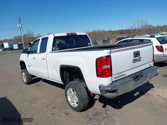 2014 GMC Sierra 1500 SLE with VIN 1GTV2UEH4EZ243092, listed as a IAAI auction lot 41827982 with 80,682 mi miles. Bid and sale history available at carsss.com. Image 3.