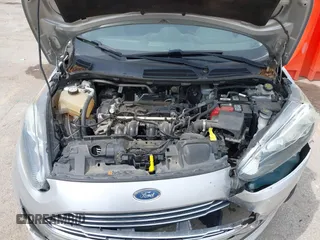 2018 Ford Fiesta SE z VIN 3FADP4BJ6JM106855, wystawiony jako IAAI lot #42491262 z przebiegiem 166 397 mil mil oraz . Historia ofert i sprzedaży dostępna na DreamBid. Obrazek 10.